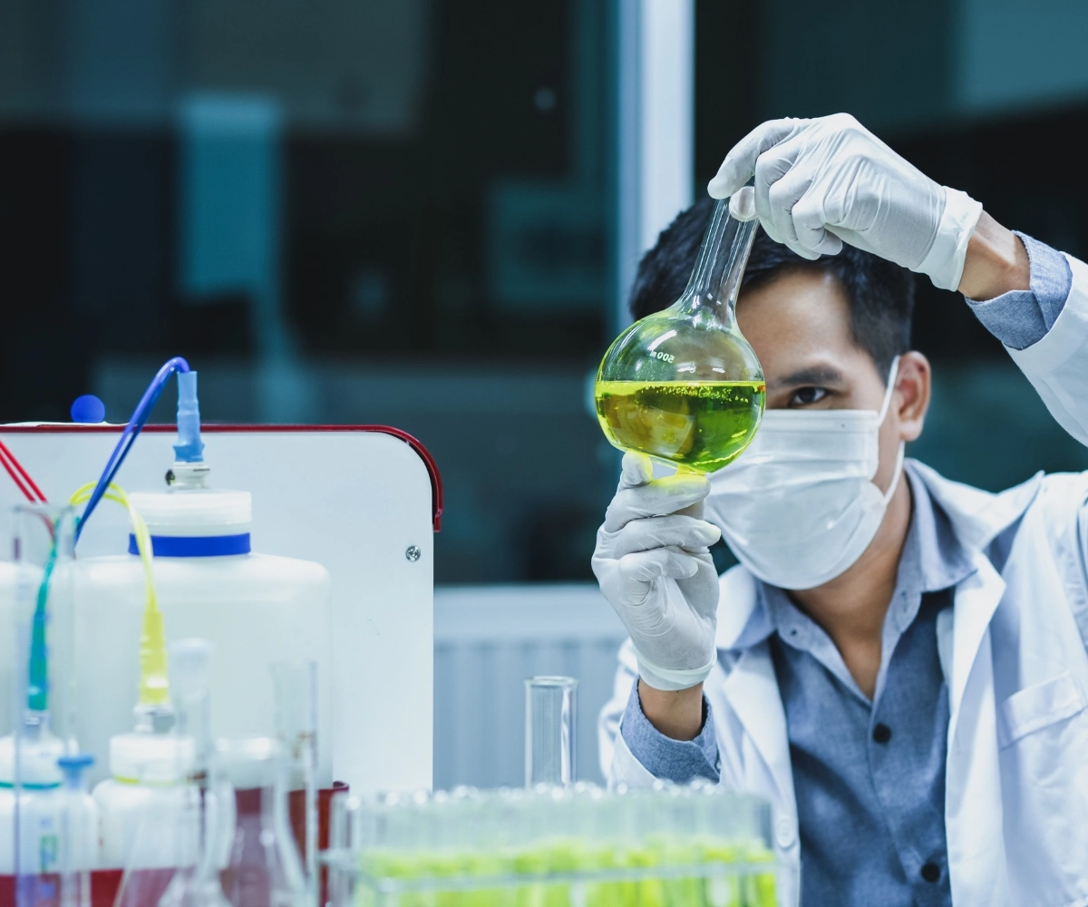 Pipette dispensing a laboratory droplet